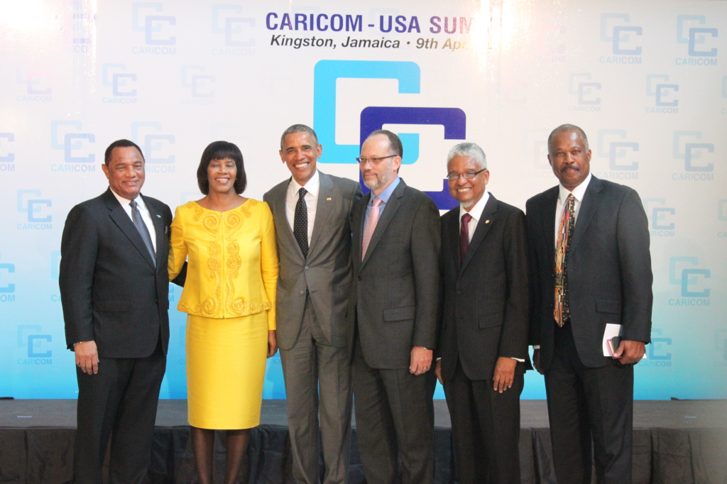 US President Barack Obama welcomed by (from left) CARICOM Chairman, Prime Minister of The Bahamas Rt. Hon. Perry Christie; Prime Minister of Jamaica The Most Hon. Portia Simpson Miller; CARICOM Secretary-General Ambassador Irwin LaRocque, outgoing UW