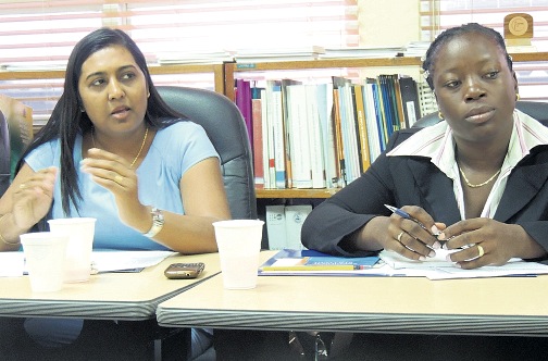 Team leader Bidiawatie Nanden-Harpal (left) makes a point during a meeting with partners at the UNFPA's office.