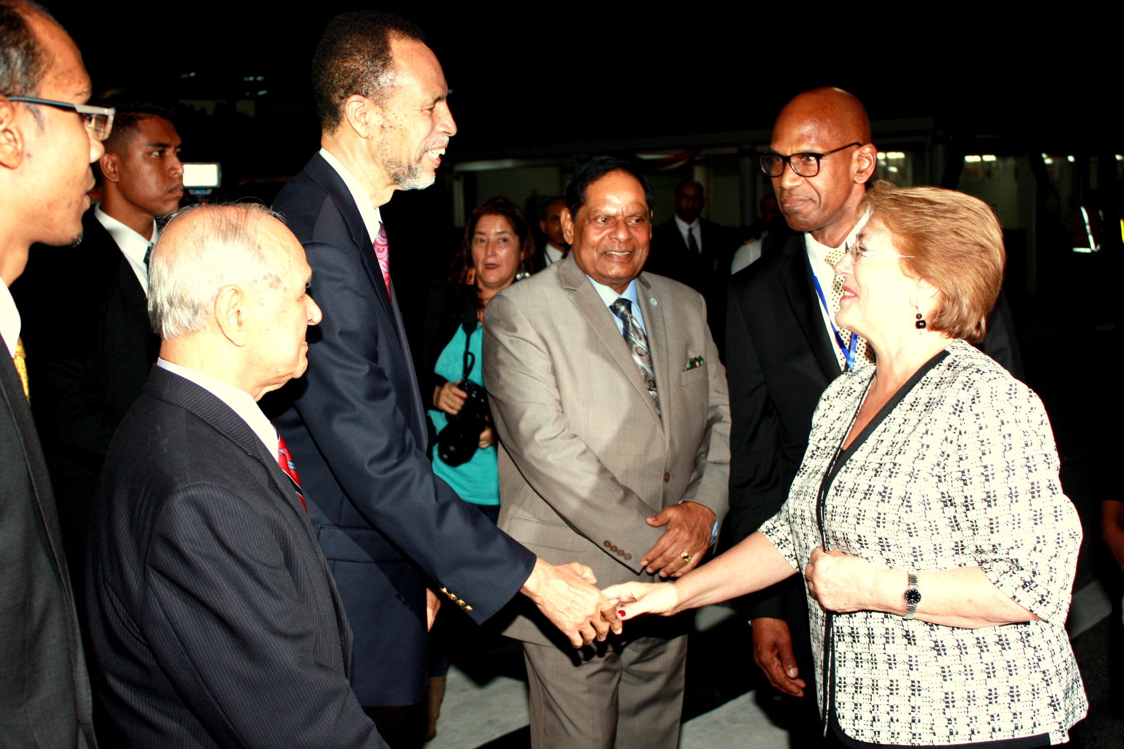 Assistant Secretary-General, Foreign and Community Relations, CARICOM Secretariat, Ambassador Colin Granderson, greets President of Chile, Her Excellency Michele Bachelet at the Cheddi Jagan International Airport