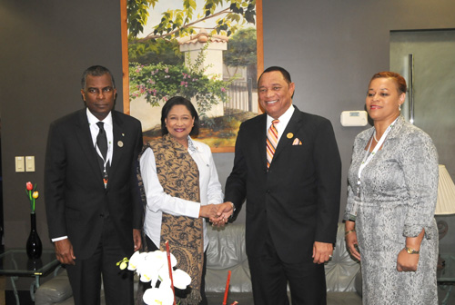 COSTA RICA &ndash; CARICOM Chairman, Prime Minister of The Bahamas Rt. Hon. Perry Christie (2nd right) greets Trinidad and Tobago&rsquo;s Prime Minister Hon. Kamla Persad-Bissessar at the Third Summit of the Community of Latin American and Caribbean