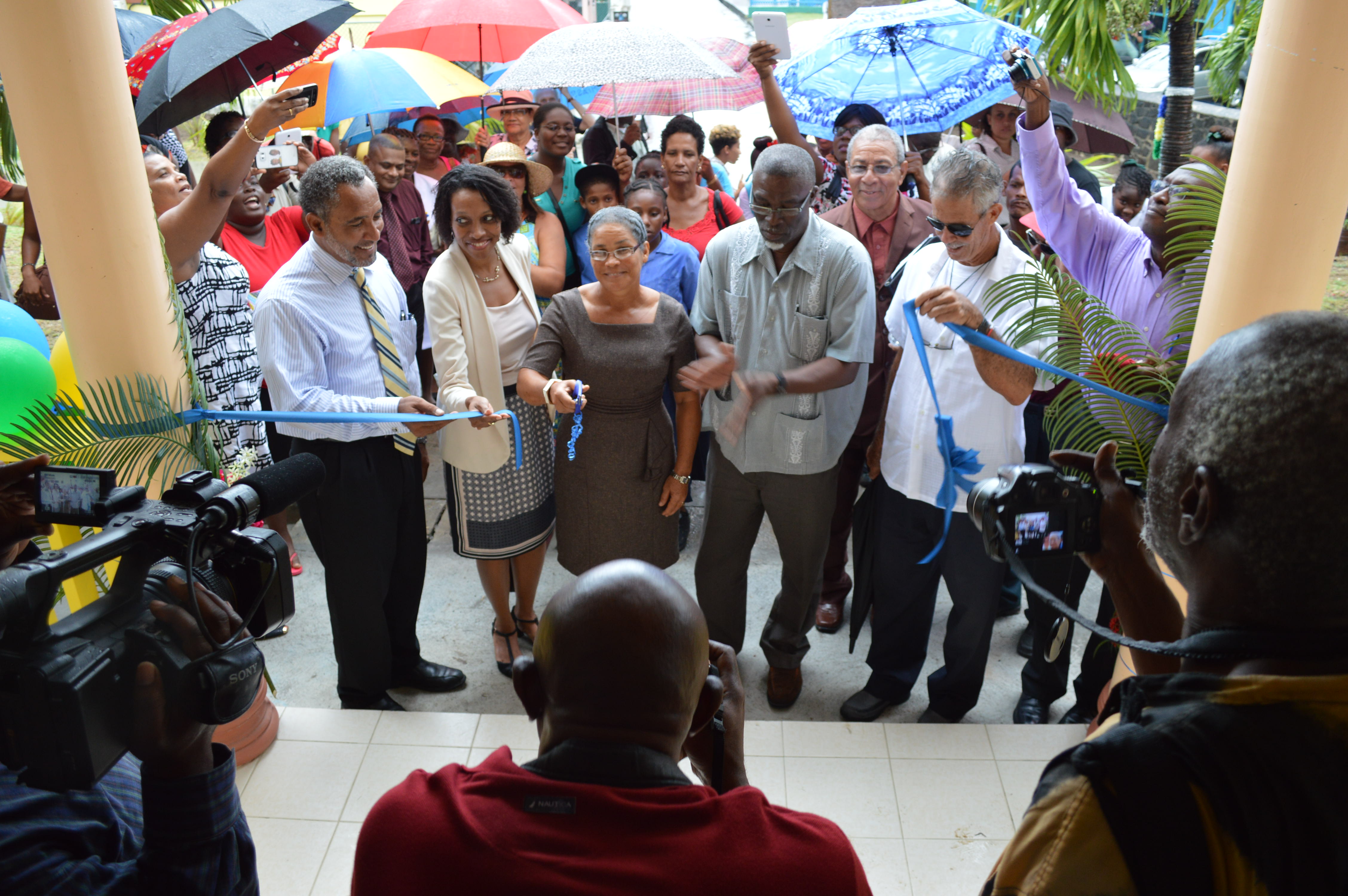 Cutting the ribbon during the handover and opening ceremony of the Bequia Hospital on October 8, 2015. From left to right: Dr. the Hon. Godwin Friday, Parliamentary Representative for the Northern Grenadines; Sister Reanna Olliviere; Darran Newman, P