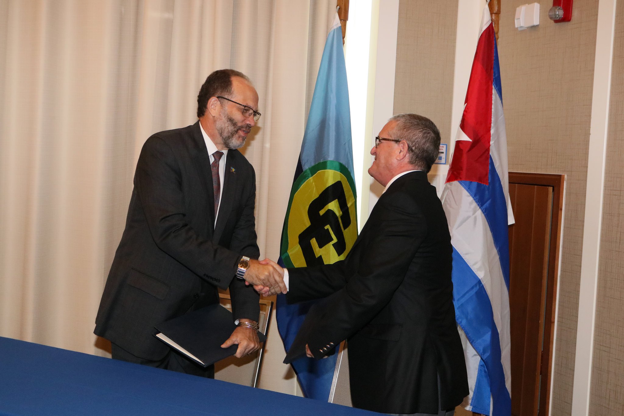 Caricom-cuba-signing-ceremony-hnadshake-between-sg-and-amb.-marchante