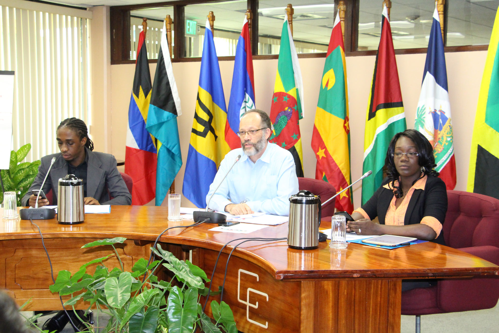 CARICOM Secretary-General, Ambassador Irwin LaRocque flanked by Guyana's CARICOM Youth Ambassadors at the social media interaction that was anchored at the CARICOM Secretariat