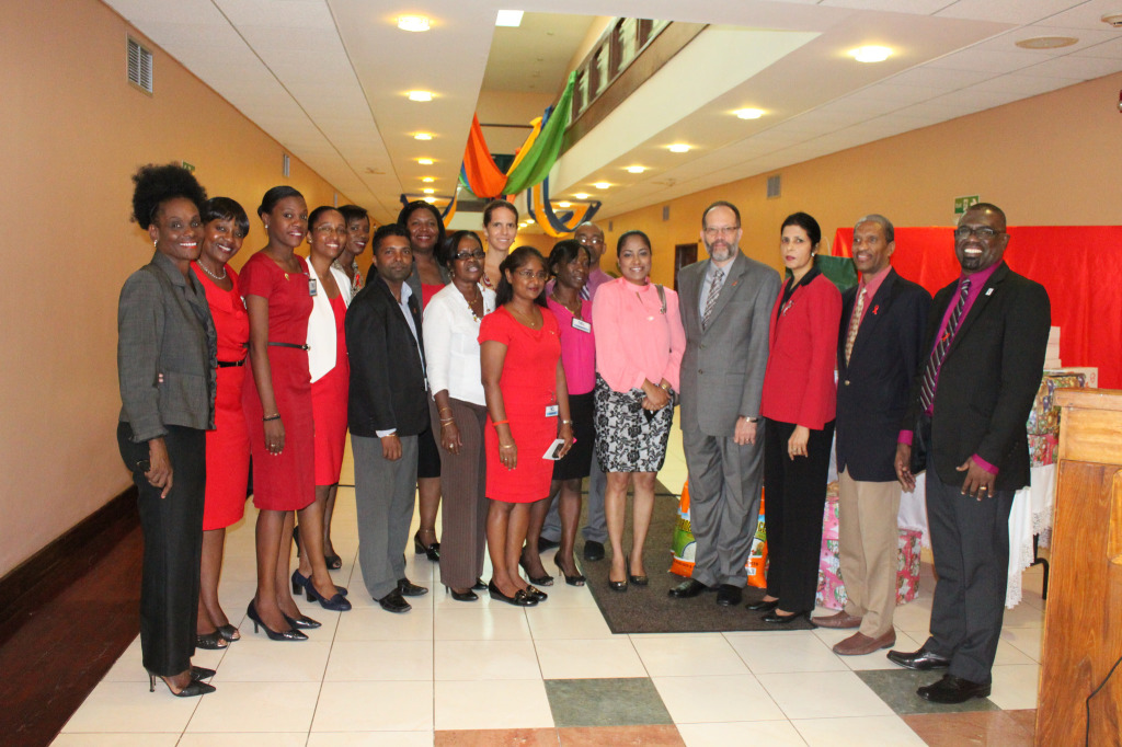 CARICOM Secretary-General, Amb. Irwin LaRocque and Deputy Secretary, Amb. Manorma Soeknandan, in a Kodak moment with staff of the Secretariat, and representatives of the National AIDS Programme Secretariat (NAPS) at a ceremony  to hand over the  CARI