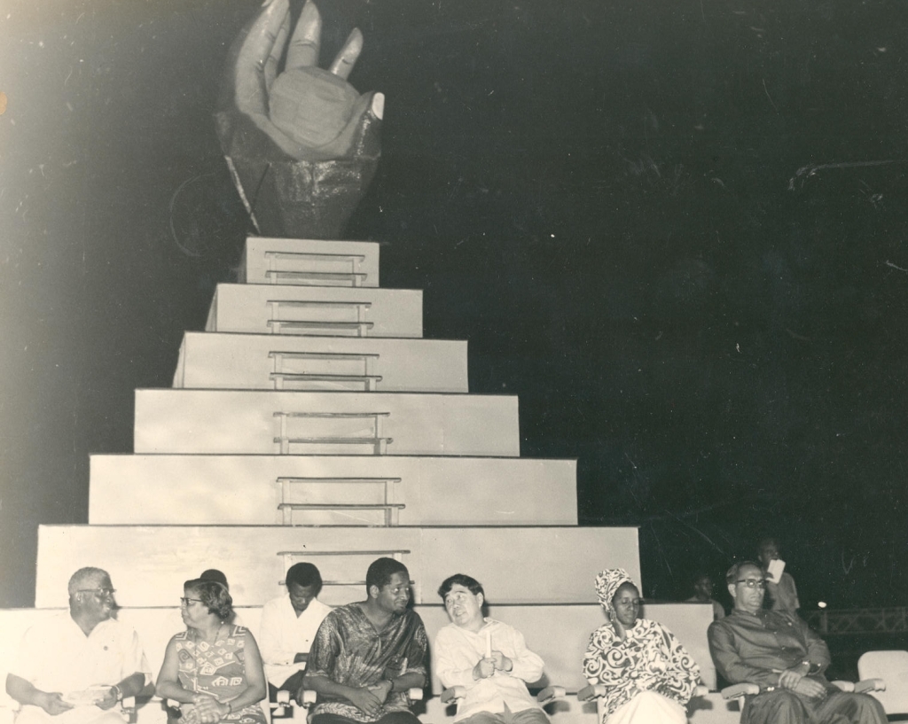 At the closing ceremony of CARIFESTA 1972 is the CARIFESTA logo &ndash; a dark hand grasping the sun, depicting the skills and aspirations of the tropical man with talent untold&rsquo;. In the foreground are (second and third from left respectively)