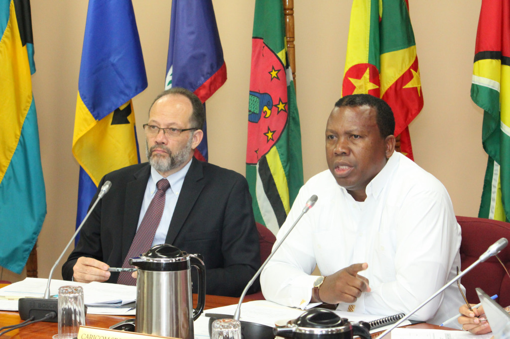 Chair of the Inaugural Meeting of the CARICOM Committee of Ambassadors, and Ambassador of The Bahamas to CARICOM, H.E. Picewell Forbes addresses the Meeting while Secretary-General Ambassador Irwin LaRocque listens attentively.