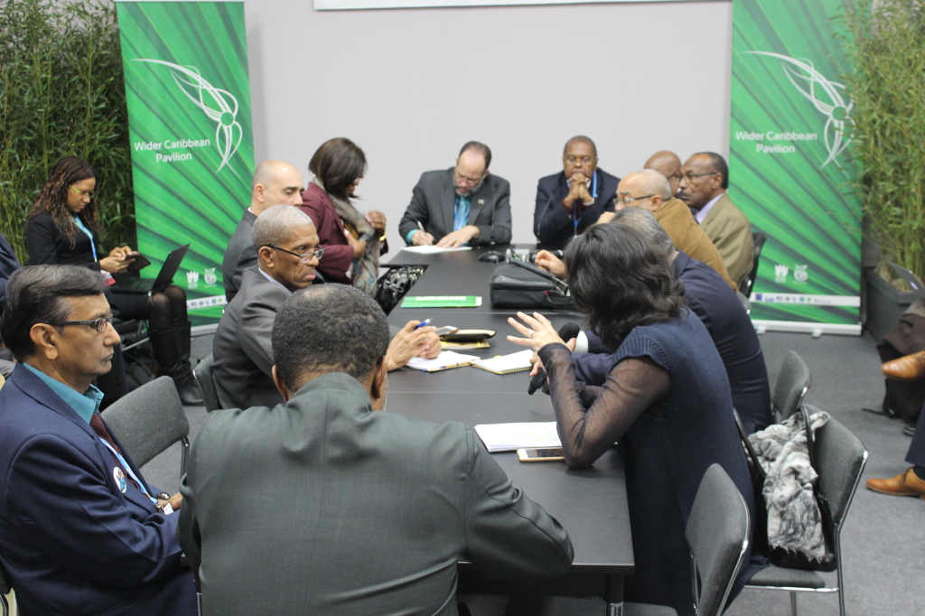 Dr. Jimmy Fletcher, Chairman of the CARICOM Task Force on Climate Change shares the head table with CARICOM Secrtary-General Ambassador Irwin LaRocque at a CARICOM caucus at COP 21