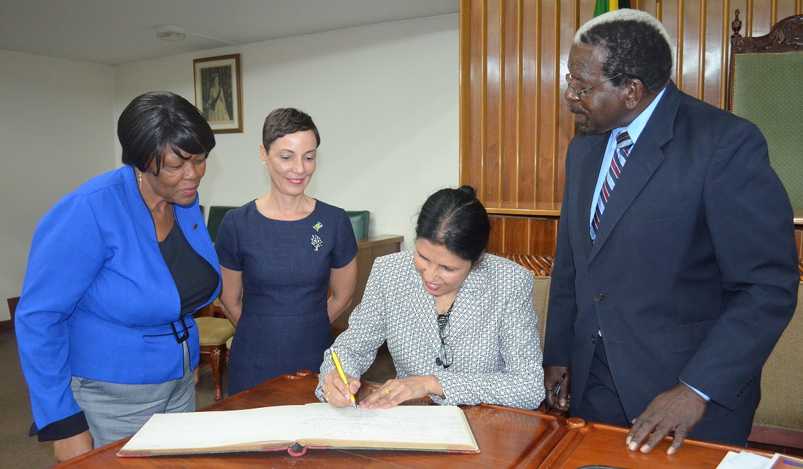 CARICOM Deputy Secretary-General signs guest book at Jamaica House of Assembly