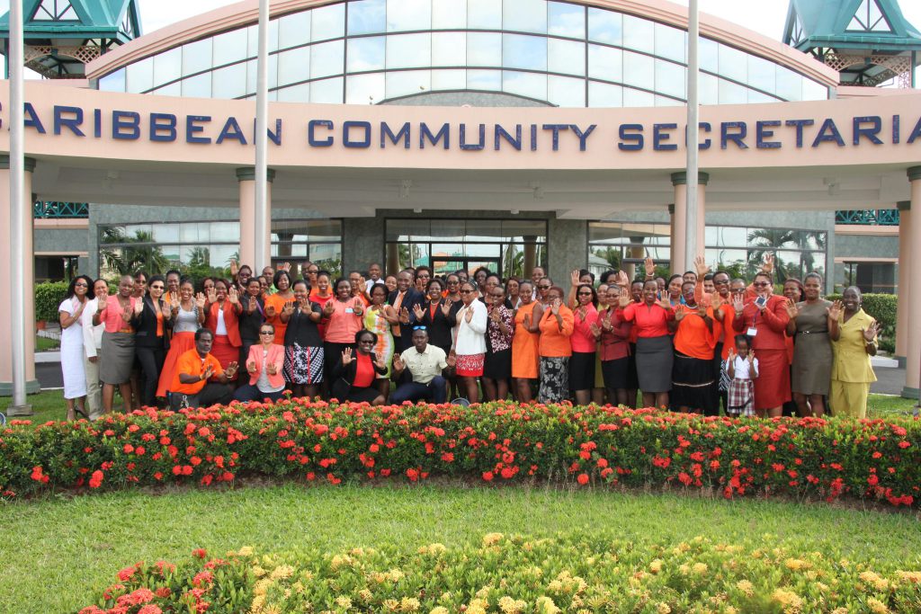 #PressforProgress: CARICOM Secretariat members of staff - most dressed in orange - pose for a group photograph on International Women's Day 2018