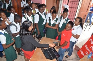 Students visiting the Digicel booth at the the International Girls in ICT Day, Tech Day Camp at the Lichas Hall, Linden, Region 10