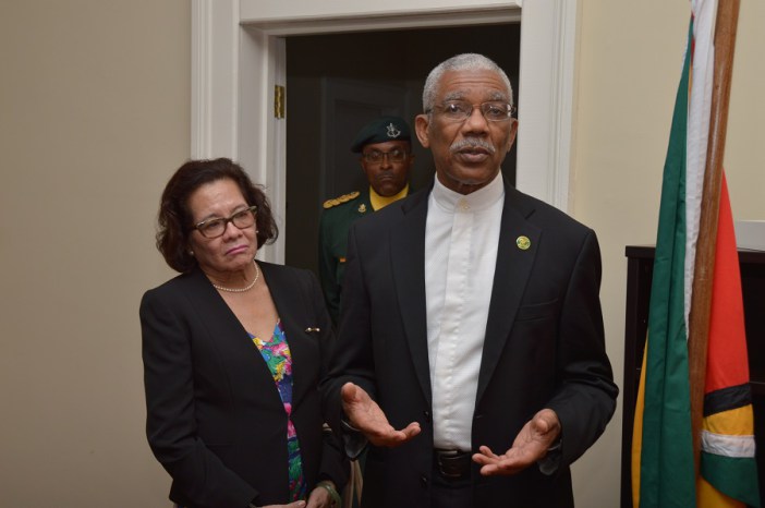 President David Granger addressing the staff of Guyana’s Consulate in Barbados as First Lady. Mrs. Sandra Granger listens intently (Photo via Ministry of the Presidency)