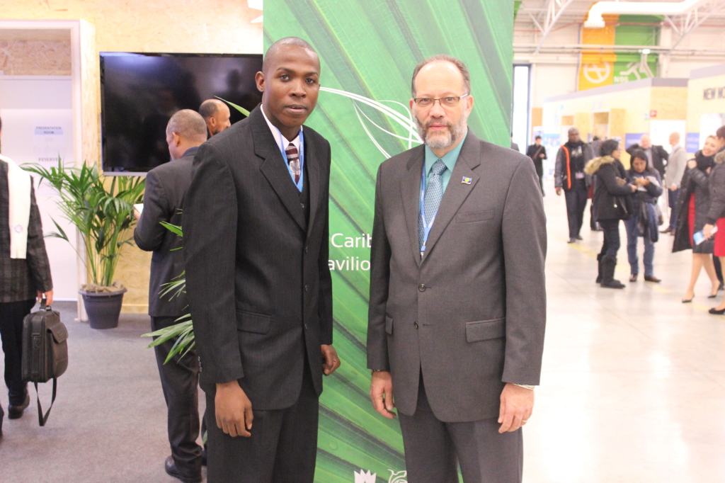 CARICOM Secretary-General, Ambassador Irwin LaRocque (r) and Caribbean Youth Environment Network&rsquo;s Special Envoy Mr. Stefan Knights meet outside the Caribbean Pavilion at COP 21, Paris France