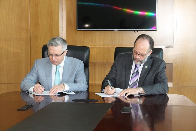 Signing of the Agreement - CARICOM Secretary-General Amb. Irwin LaRocque (right) and Kazakhstan's Ambassador His Excellency Mr. Konstantin Zhigalov.