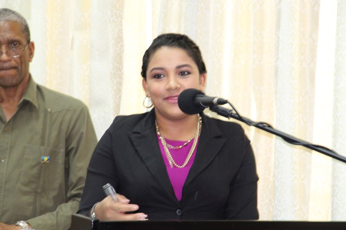 Tarun Butcher, Moderator, Session One, Day, delivers a summary of the session. Also in photograph is CARICOM Assistant Secretary-General, Human and Social Development, Dr. Douglas Slater