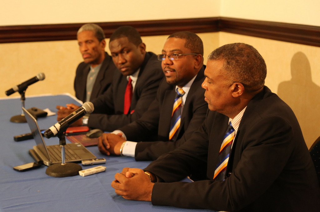 Dr. Douglas Slater, Assistant Secretary-General, CARICOM Secretariat (left), Wavell Hinds, President of WIPA (2nd left), and Michael Muirhead, Chief Executive Officer of WICB (right) listen to re-elected WICB President Dave Cameron, following the Ann