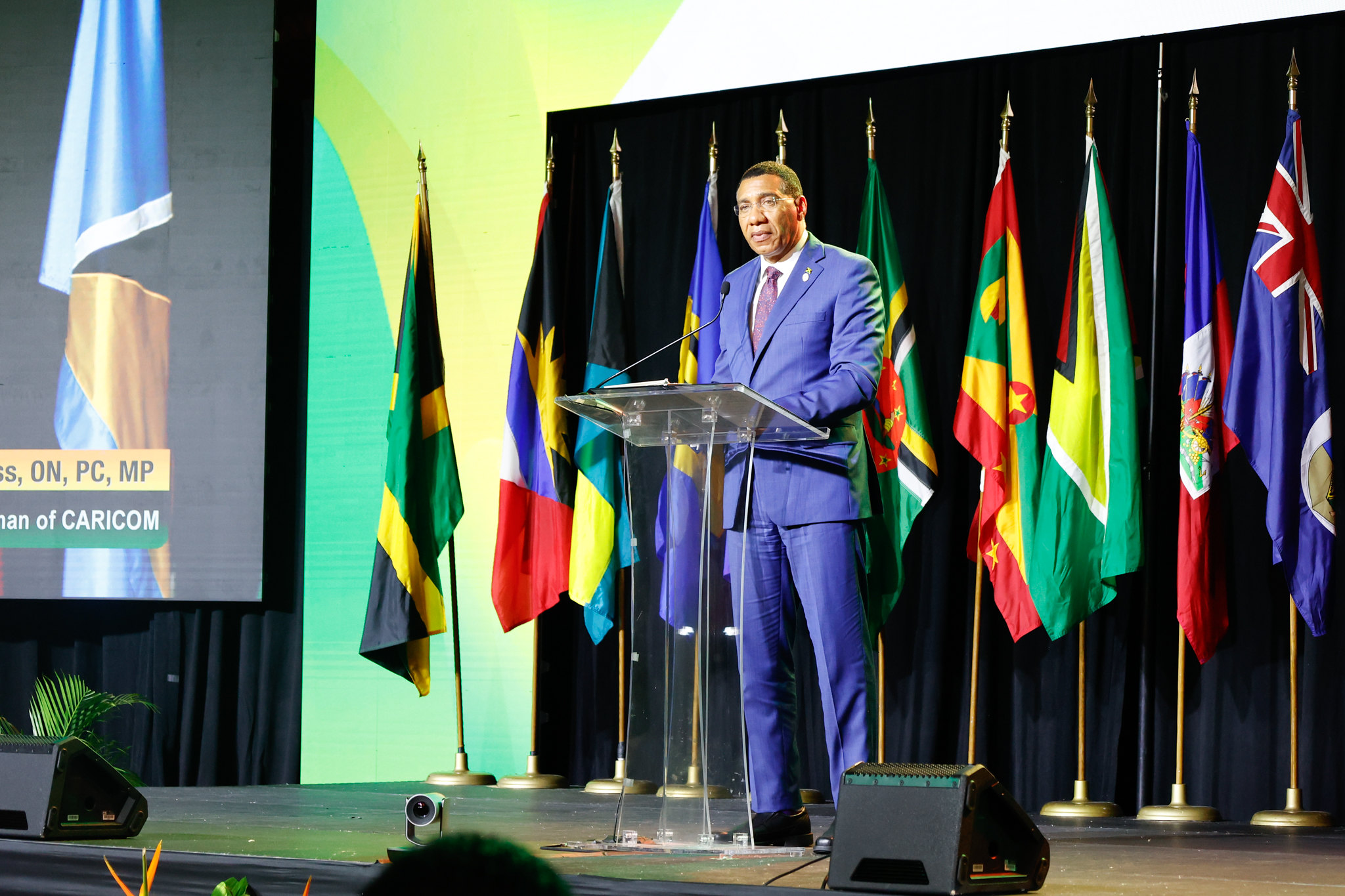 PM Holness at podium