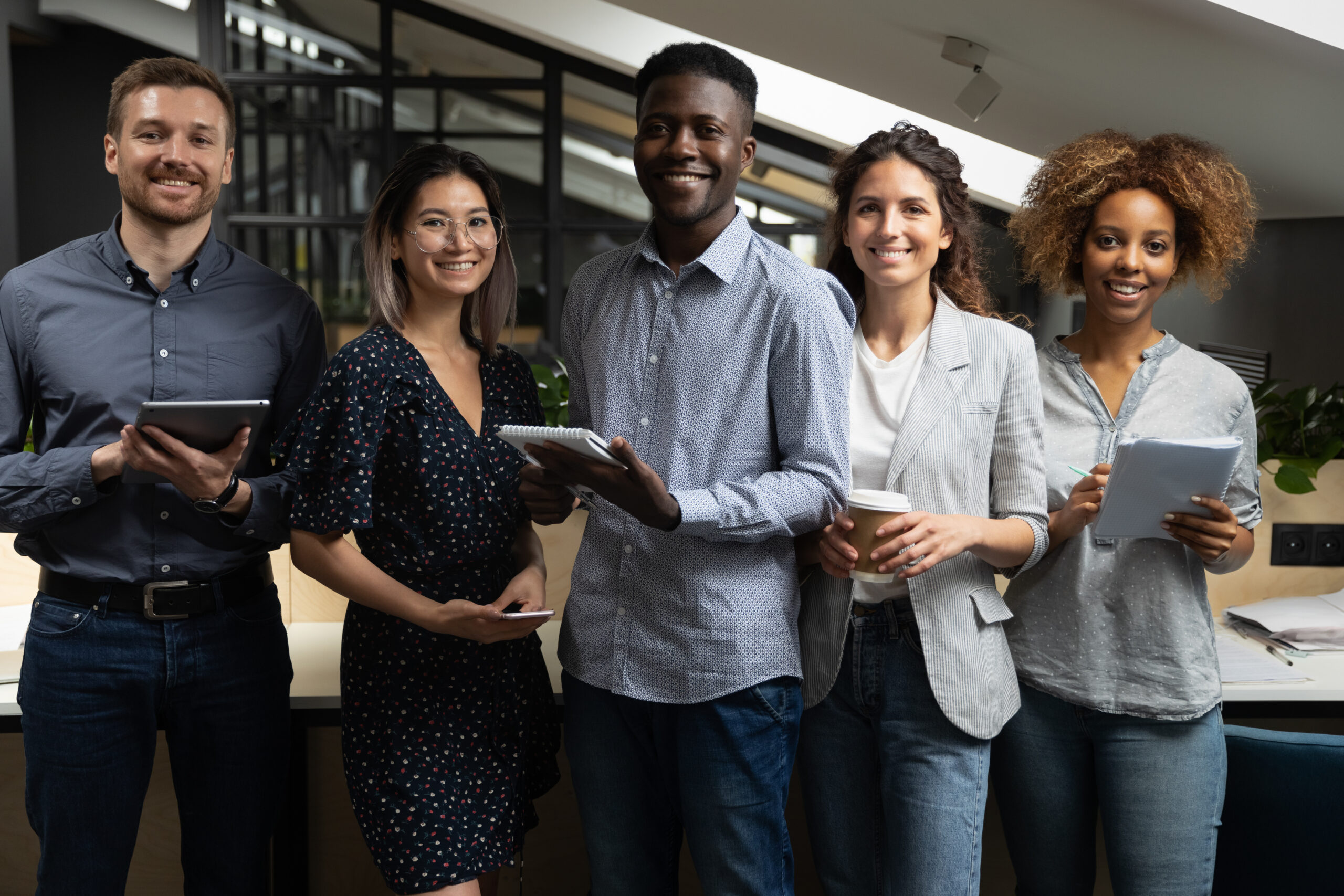 Portrait,Of,Happy,Successful,Multiracial,Business,Team,Standing,With,Digital