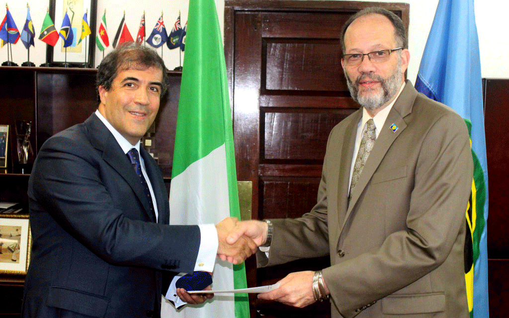 CARICOM Secretary-General Ambassador Irwin LaRocque (right) receives the Letter of Accreditation from Italy&rsquo;s Ambassador to CARICOM His Excellency Silvio Mignano.