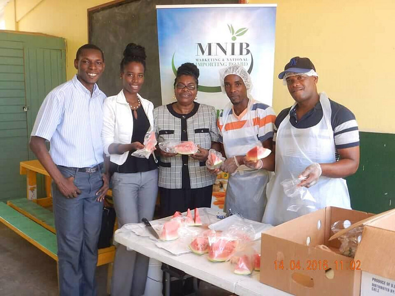 Grenada's CARICOM Youth Ambassadors Amanda Scott and Judd Cadet at a Fruit Day that they organised at the St. George&rsquo;s Methodist Primary School