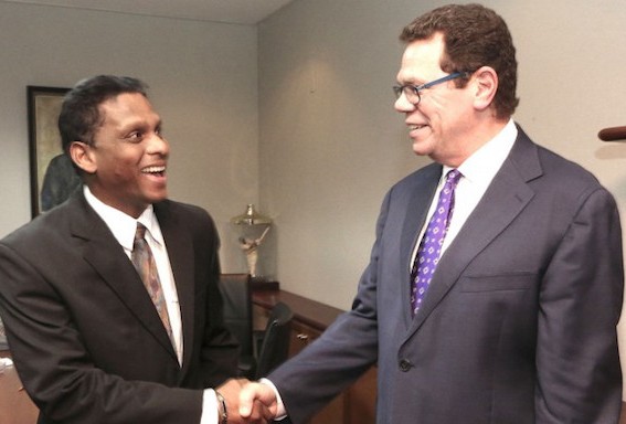 Clint Ramcharan, Director for Trinidad and Tobago (left) with CDB President, Dr Warren Smith