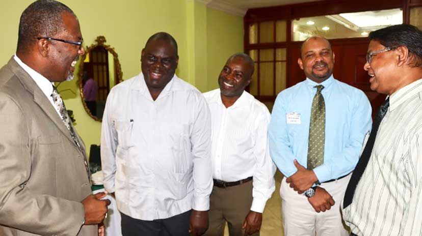 State Minister for Agriculture, Labour and Social Security, Hon. Luther Buchanan (left), shares a light moment with (from right): Regional Representative, Commonwealth Agricultural Bureaux International (CABI) Naitram Ramnanan; Global Director, Monit