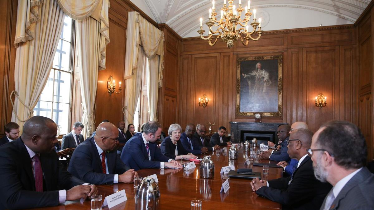 PM Harris, centre right across from UK PM Theresa May