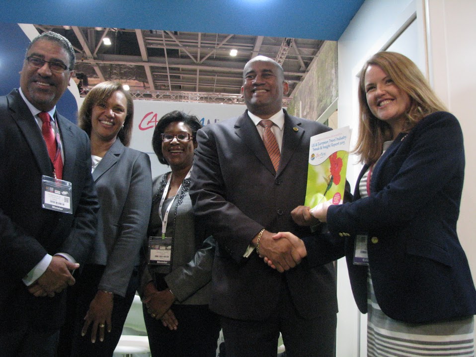 Pippa Jacks (R) of Travel Trade Gazettes presents a copy of CTO UK Travel Industry Trends &amp; Insights Report 2015 to CTO chairman Richard Sealy, Minister of Tourism of Barbados. Also in photo, from left, are, Jamaica&rsquo;s Minister of Tourism Wy