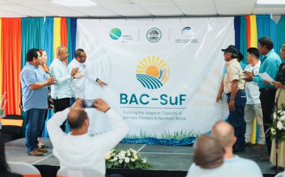 CCCCC, Belize event - officials and banner