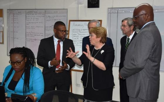 Chile&rsquo;s President, Michelle Bachelet and Executive Director of CDEMA, Ronald Jackson, chatting while on a tour of the Agency&rsquo;s headquarters today. Also pictured is Attorney General and Minister of Home Affairs, Adriel Brathwaite (right).
