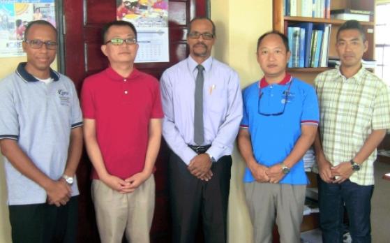 Mikhail Francis, Administrative Assistant for the CARIFICO project; Masaru Honda, Chief Advisor in the Department of Fisheries in St. Lucia; Milton Haughton, CRFM Executive Director; Mitsujiro Ishida, Marine Biologist, based at the Fisheries Division