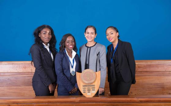 Mrs.	Jacqueline	Graham, (left)	presents	the	award	for	&lsquo;Best	Academic	Institution&rsquo;	to	Team UWI,	Cave	Hill	Campus	(Photos via CCJ) All	female	winning	team	from	the	Eugene	Dupuch	Law	School