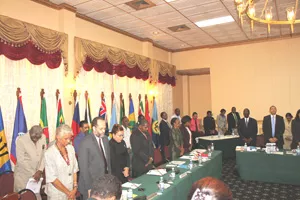 Delegates to the Twenty-Ninth Meeting of the Council for Trade and Economic Development (COTED) observe one minute silence for the victims of the earthquake in Haiti, 8 February 2010, Georgetown, Guyana